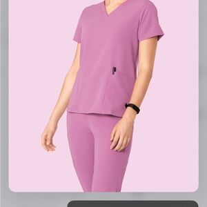 Lilac colored scrubs, size small, new with tags never been worn
